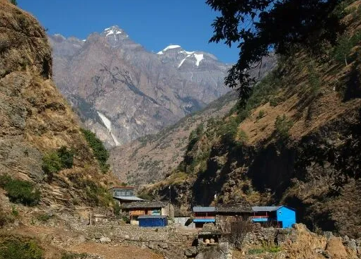 Stone houses and terraced fields of a village above the Budhi Gandaki