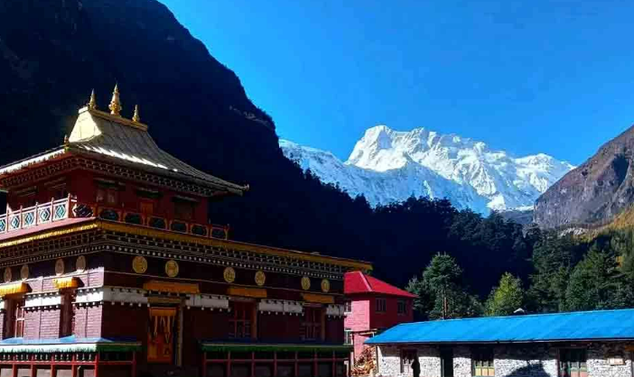 Ribung Gompa above the village of Lho, with Manaslu behind it